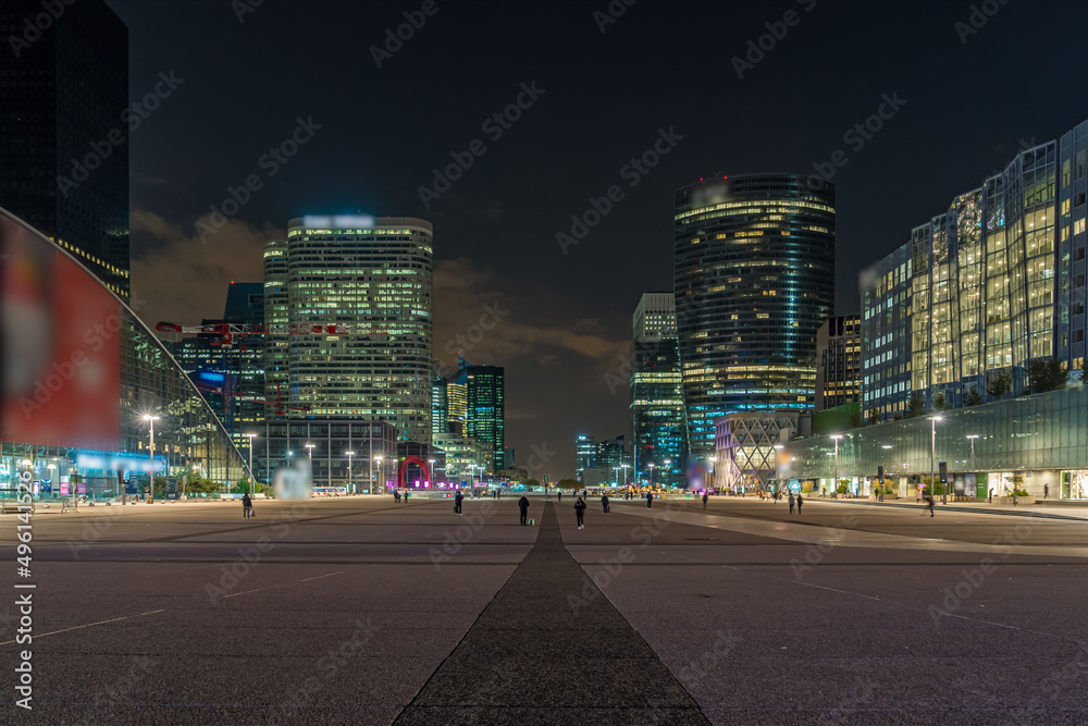 Peoples at La Defense Business District Center at Night With High Towers