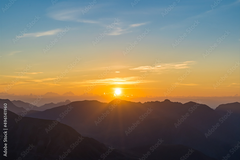 Intense Sunrise Over French Alps Mountains Peaks With Clouds