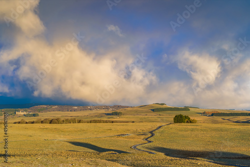 Denses and Stormy Clouds Above French Lowland Aubrac With Grass and Trees