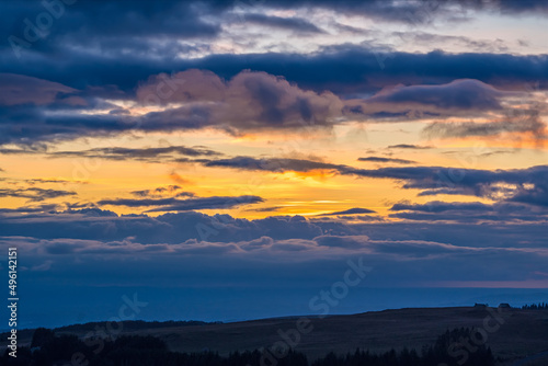 Yellow Sky With Clouds at Sunset Above French Hills © Loic Timelapse
