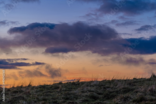 Blue Hour in the Sky Behind Top of the Hill Moving Clouds Over Landscape © Loic Timelapse