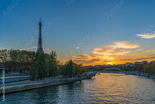 Eiffel Tower at Golden Hour in Paris With Colorful Clouds Seine River and Tourist Cruises