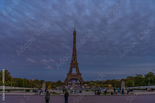 Beautiful Eiffel Tower at Night With Peoples Under Cloudy Sky and Trees © Loic Timelapse