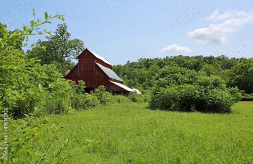 Red barn in green landscape - Tennessee photo