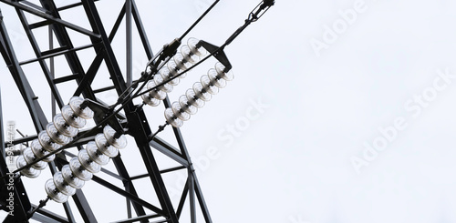 Part of a high-voltage pylon to which the cables are attached for the transport of large amounts of electrical energy over relatively large distances photo