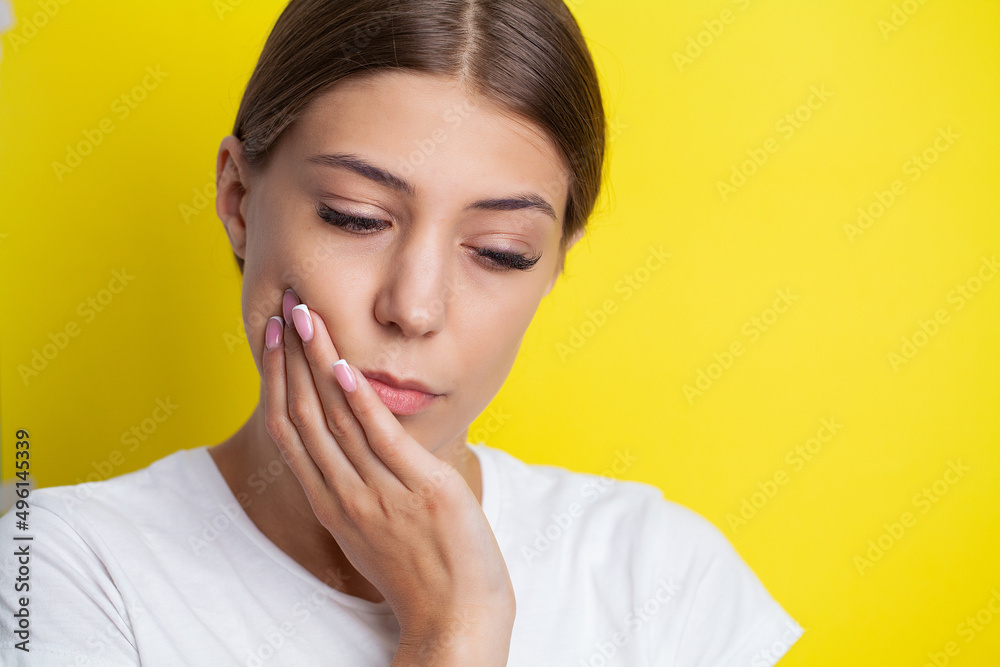 Young woman suffering from toothache, tooth decay or sensitivity. Young woman suffering from toothache, tooth decay or sensitivity.
