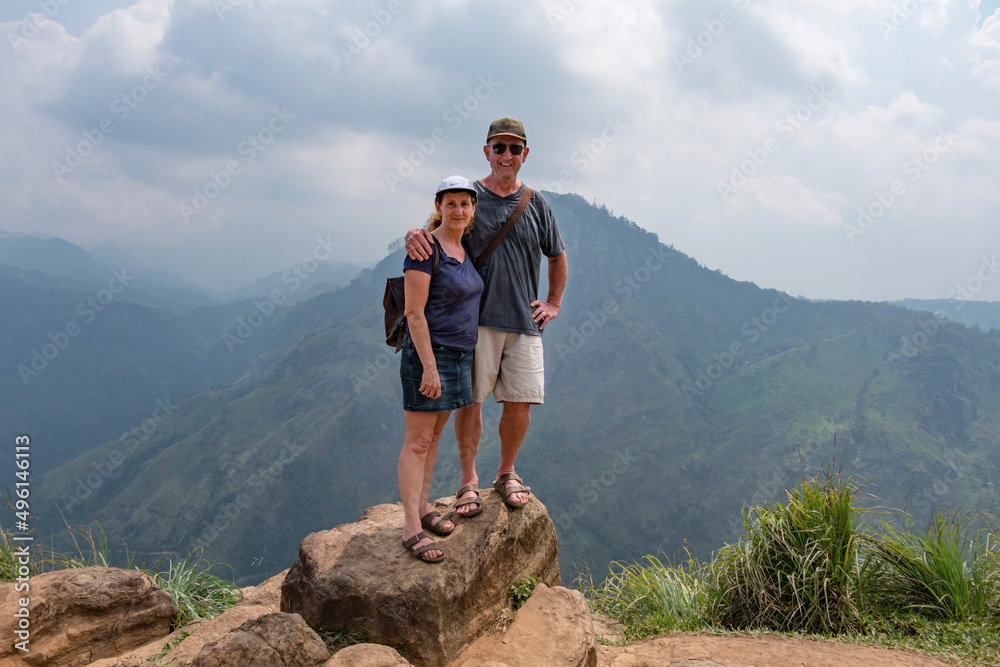 Ella, Sri Lanka A couple pose for a picture on top of a peak after a strenuous hike.