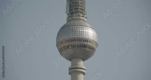 Close up of the Berliner Fernsehturm on a sunny day with the blue sky in the background photo