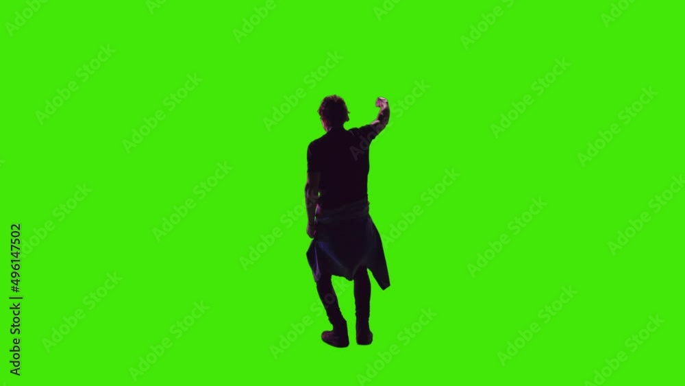 A young dance model is dancing and clapping with his hands raised facing the opposite direction on greenscreen A young dance model is dancing and clapping with his hands raised facing the opposite direction on greenscreen