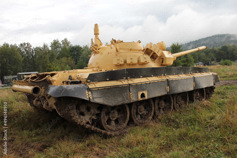 A historic tank standing in the field before the shows A historic tank standing in the field before the shows