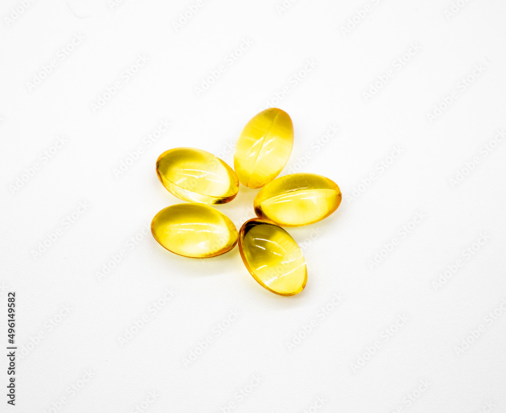 fish oil supplement capsules higher vitamin and omega-3 in selective focus isolated on white background
