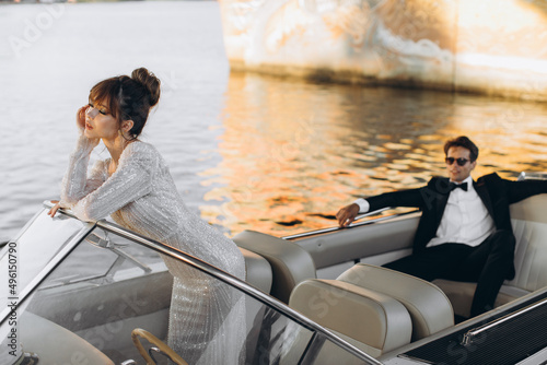 beautiful gentle happy couple posing on a yacht the background the sea © ALEXSTUDIO
