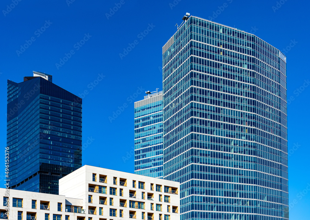 Newly developed towers of office skyscrapers over rondo Daszynskiego circle in booming Wola business district of city center in Warsaw, Poland Newly developed towers of office skyscrapers over rondo Daszynskiego circle in booming Wola business district of city center in Warsaw, Poland