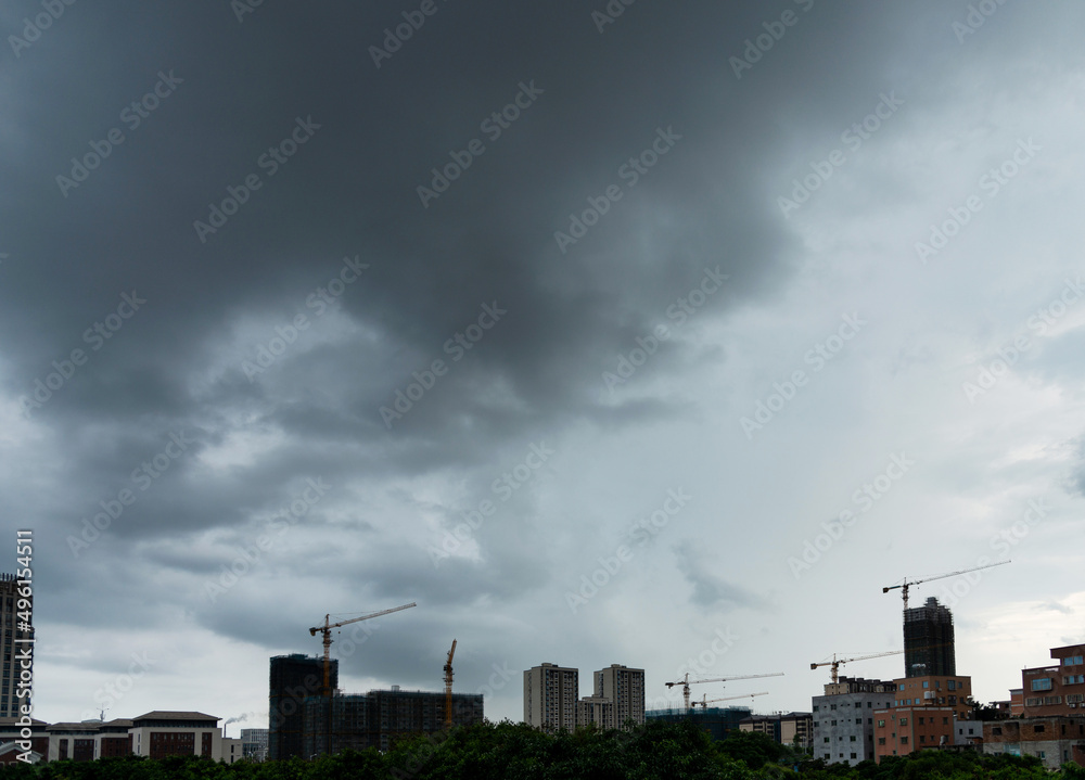 Unfinished building under dark clouds Unfinished building under dark clouds