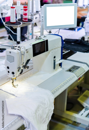 Modern sewing machine in workshop