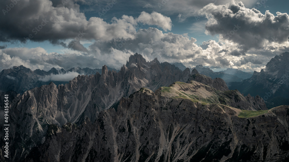 Mountain panorama with clouds in sky in the Dolomite Alps in South Tyrol, Italy.