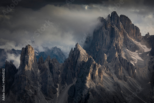 Mountain peaks in the Dolomite Alps in South Tyrol with dramatic cloudy sky, Three Peaks Nature Reserve, Italy. photo