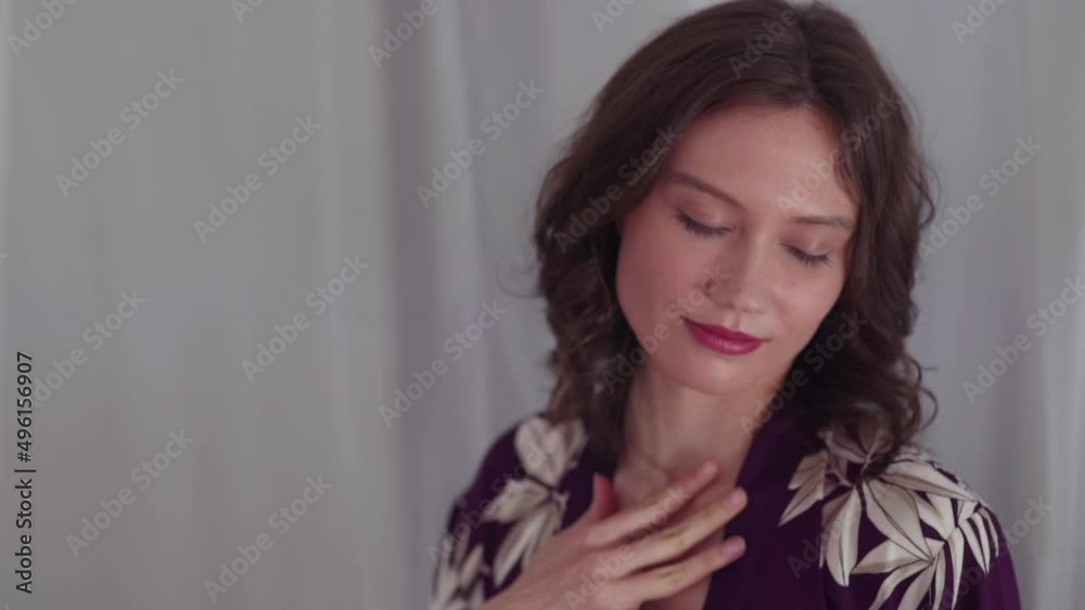 Girl's face smiling from the pleasure of stroking the body Girl's face smiling from the pleasure of stroking the body