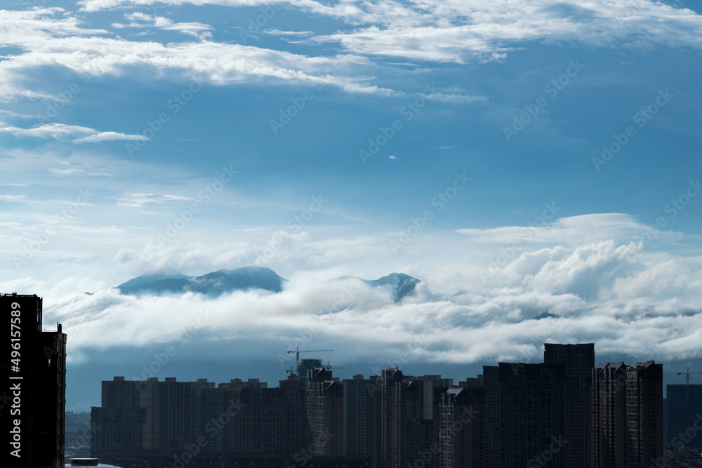 Fototapeta premium Unfinished buildings under cloud sky