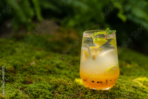 Mango passionfruit margarita cocktail with lime. Tropical alcoholic drink for summer 