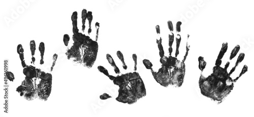 Fotografie Set hand print in black paint isolated on white