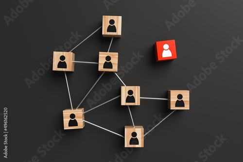 Wooden blocks with people icon with one standing out from the group on a black background. Concept of innovation, solutions, uniqueness, individuality and thinking differently. 3d rendering.