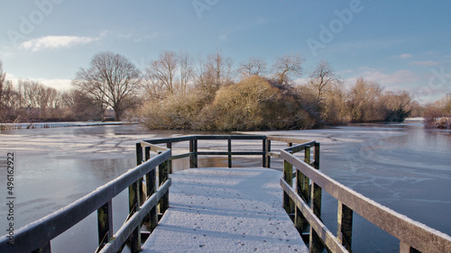 wooden bridge over the winters lake © michael