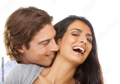 Hes a tease. Portrait of a multi-ethnic couple isolated on a white background.