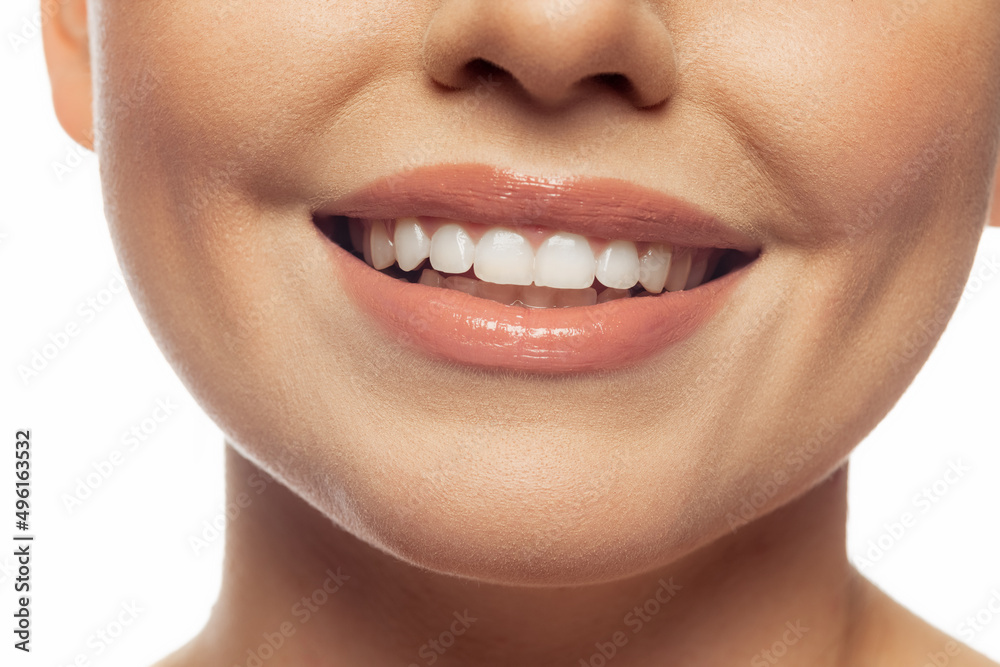 Obraz premium Cropped image of beautiful female lips, teeth, neck and chin isolated over white studio background.