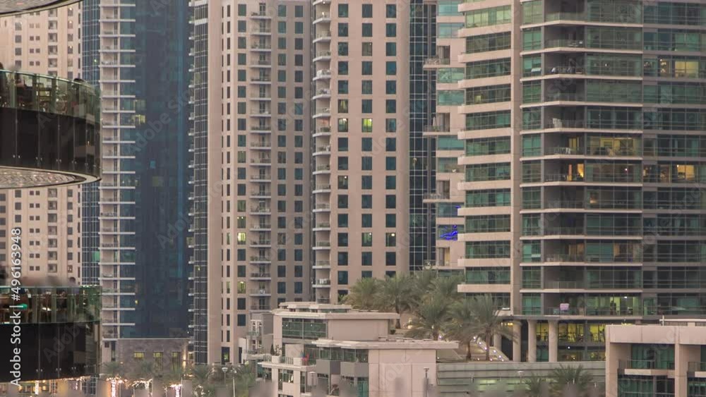 Dubai Marina towers and canal in Dubai day to night timelapse Dubai Marina towers and canal in Dubai day to night timelapse