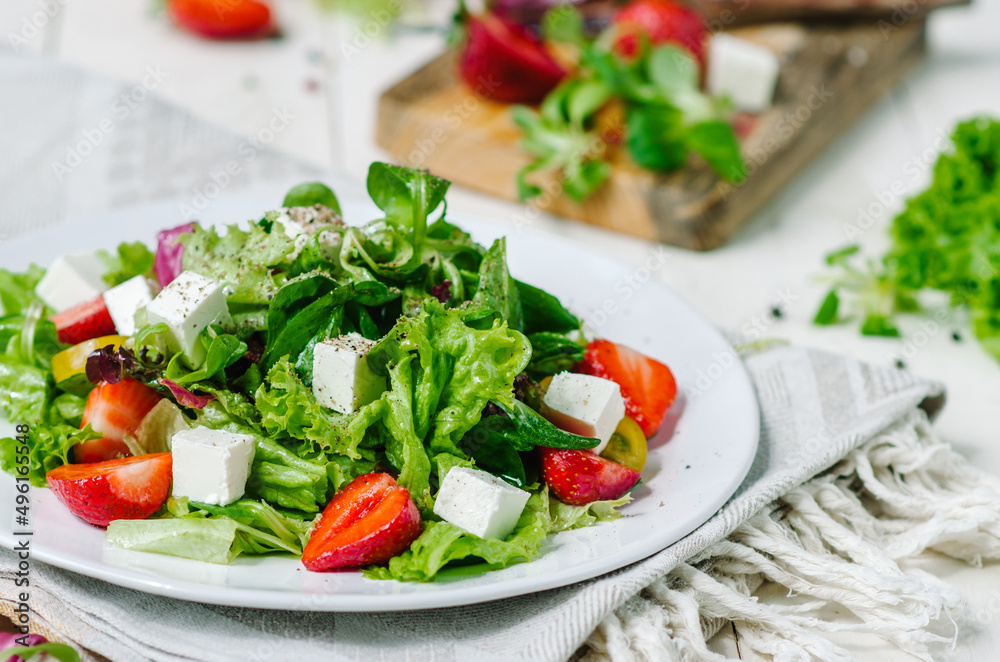 Fresh salad with feta cheese, strawberry and and salad mix Fresh salad with feta cheese, strawberry and and salad mix