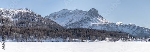 piz Bacun and frozen lake, near Maloja, Switzerland photo
