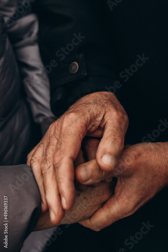 Hands of a beautiful senior couple. grain effect. selective focus