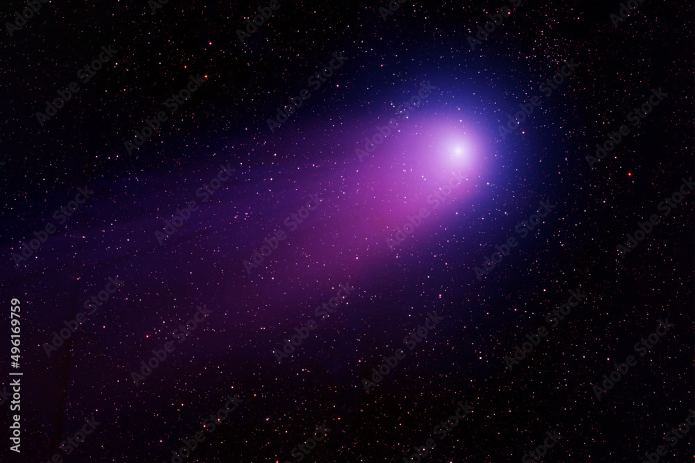 Bright comet on a dark background. Elements of this image furnished by NASA