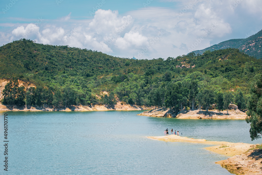 family playing in the coastline of Tai Lam Chung Reservoir, Hong Kong, summer, daytime