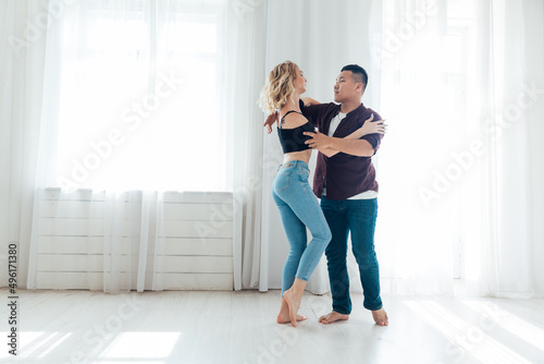 a man and a woman dance together a bachata dance to music