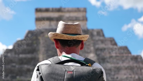 Tourist man visit Chichen Itza is a large pre-Columbian city built by the Maya people which has Mesoamerican Pyramids. The archeological site is located in Tinúm Municipality, Yucatán State, Mexico. photo
