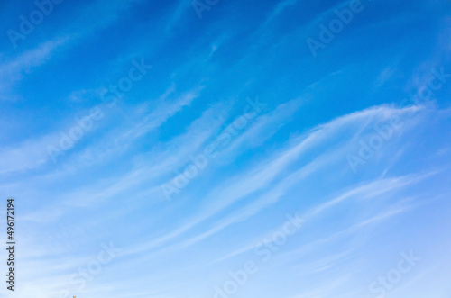 Blue sky with windy clouds. Natural background