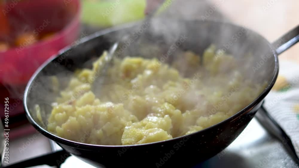 Close up frying potatoes in a pan Close up frying potatoes in a pan