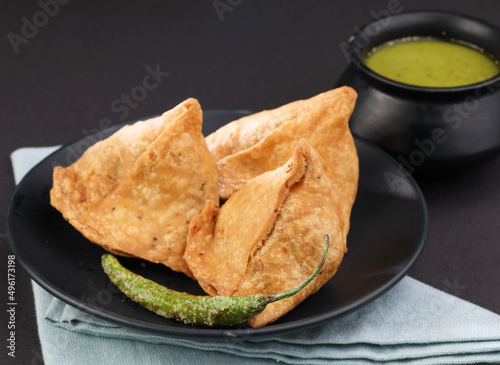 Veg Samosa - is a crispy and spicy Indian triangle shape snack which has crisp outer layer of maida filling of mashed potato, peas and spices