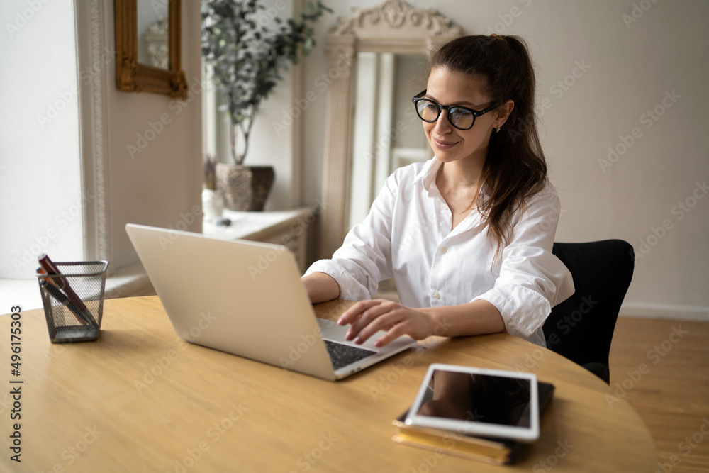 Financier with glasses woman working in office monthly budget report, formal stylish clothes Financier with glasses woman working in office monthly budget report, formal stylish clothes