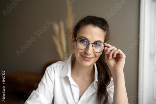 Portrait of a woman with glasses in the office