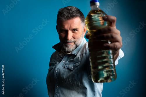 Man showing expensive sunflower oil