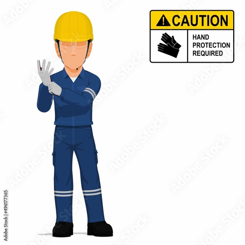 An industrial worker is putting on the gloves on white background