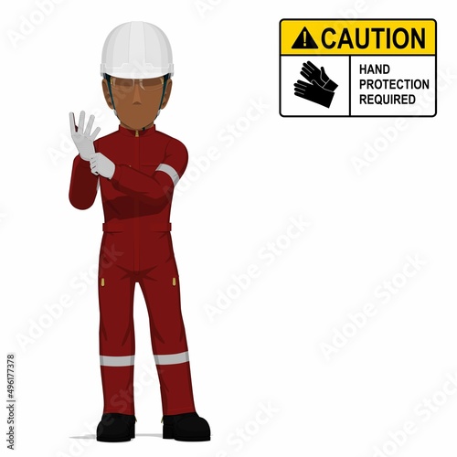 An industrial worker is putting on the gloves on white background