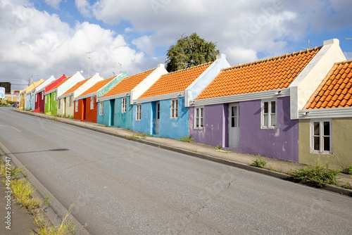 Fototapeta Naklejka Na Ścianę i Meble -  Small colorful houses along the road somewhere in Willemstad, Curacao