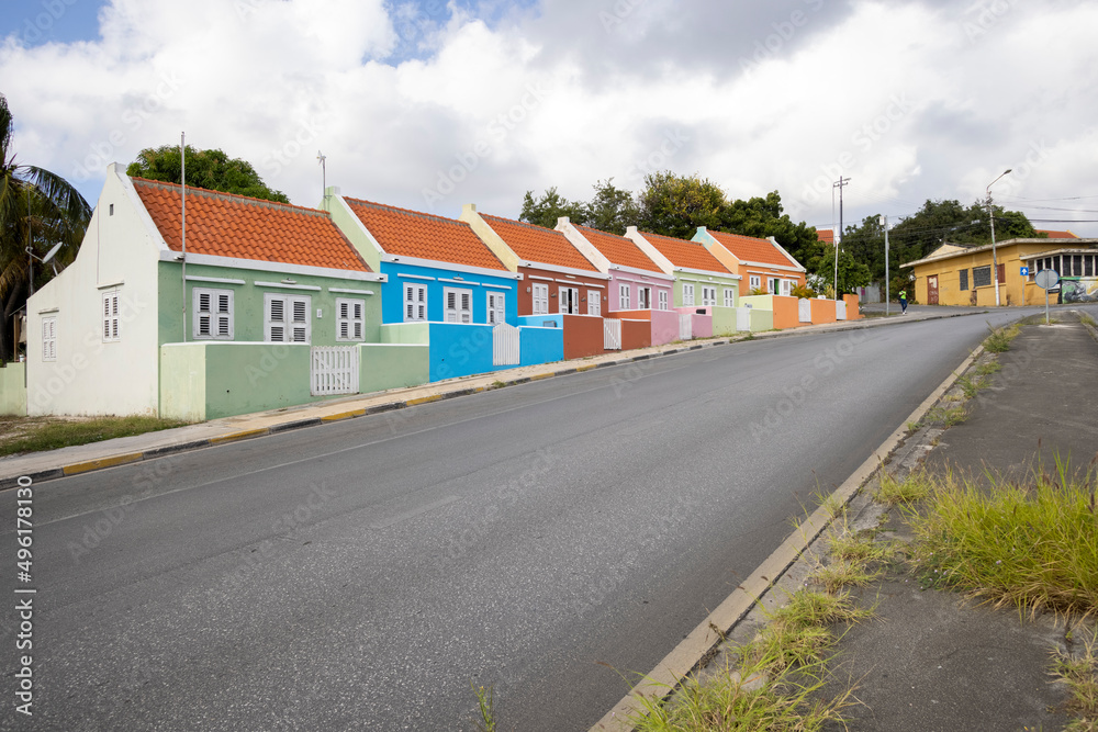 Small colorful houses along the road somewhere in Willemstad, Curacao Small colorful houses along the road somewhere in Willemstad, Curacao