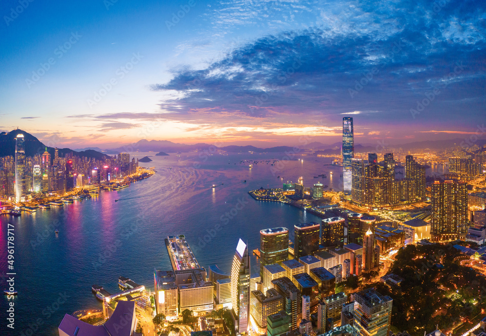 Aerial view of the Victoria Harbour, Hong Kong, at Twilight time. famous travel destination.
