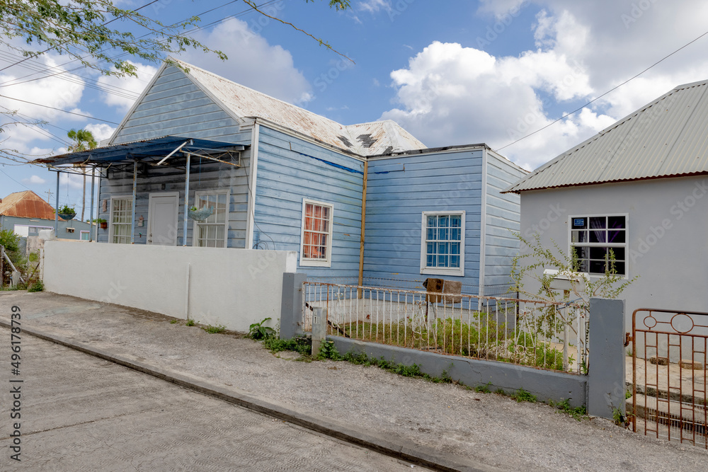 House with light blue wooden facade and white framing in the suburbs of Willemstad, Curacao House with light blue wooden facade and white framing in the suburbs of Willemstad, Curacao