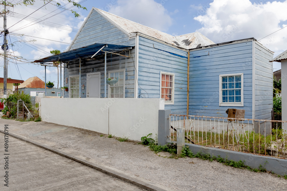 House with light blue wooden facade and white framing in the suburbs of Willemstad, Curacao House with light blue wooden facade and white framing in the suburbs of Willemstad, Curacao